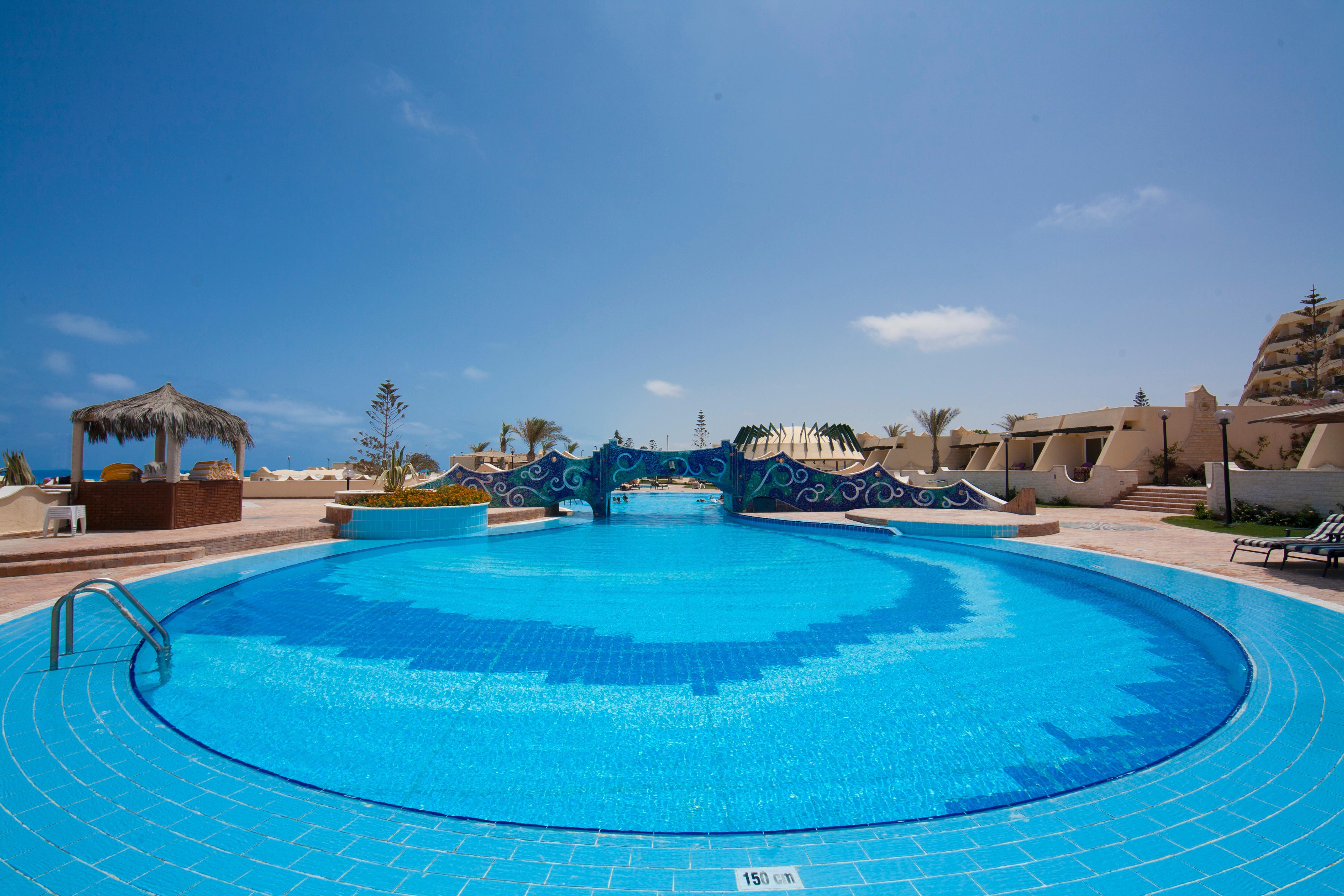Borg El Arab Beach Resort Exterior photo A swimming pool at a resort in Egypt
