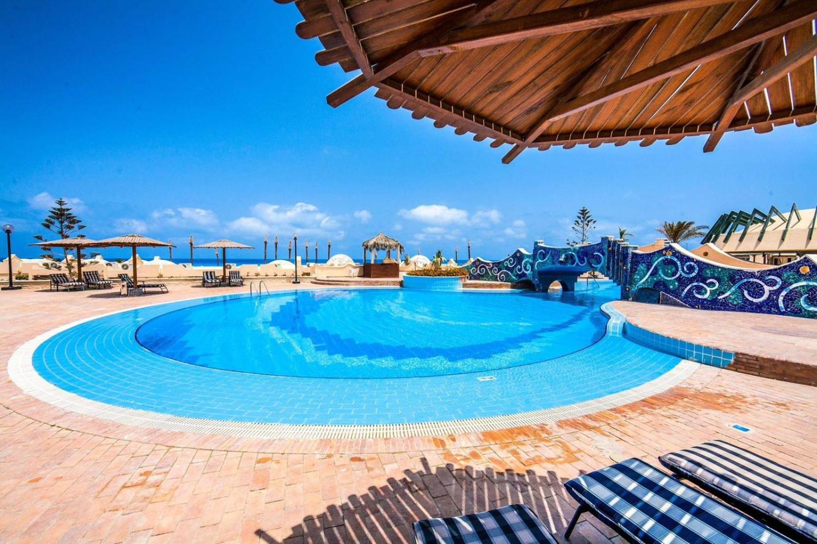 Borg El Arab Beach Resort Exterior photo The swimming pool at the hotel